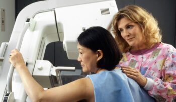Woman receiving mammogram