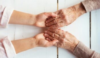 Two people holding hands