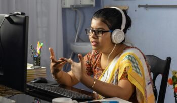 Indian young woman at computer
