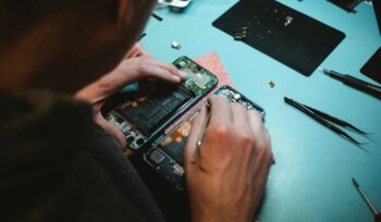 Person repairing a smartphone