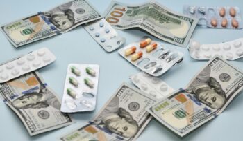 Dollar bills and pills, representing medical debt
