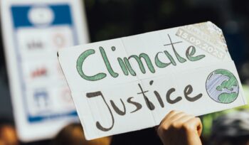 Climate justice protest sign