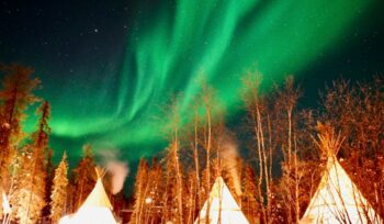 Northern lights over teepees